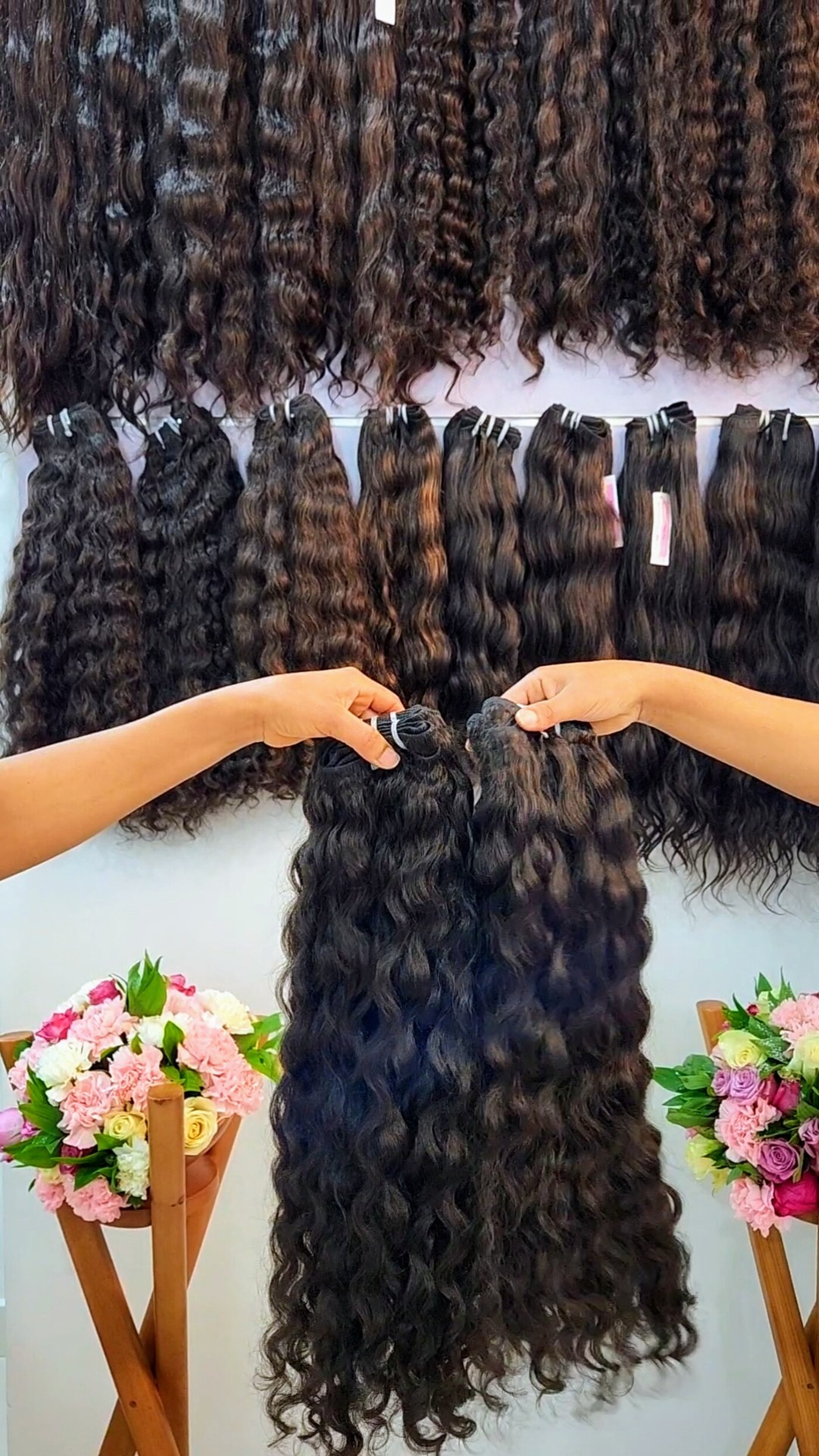 Curly hair extensions in different textures, photographed at Bloom Beauty.