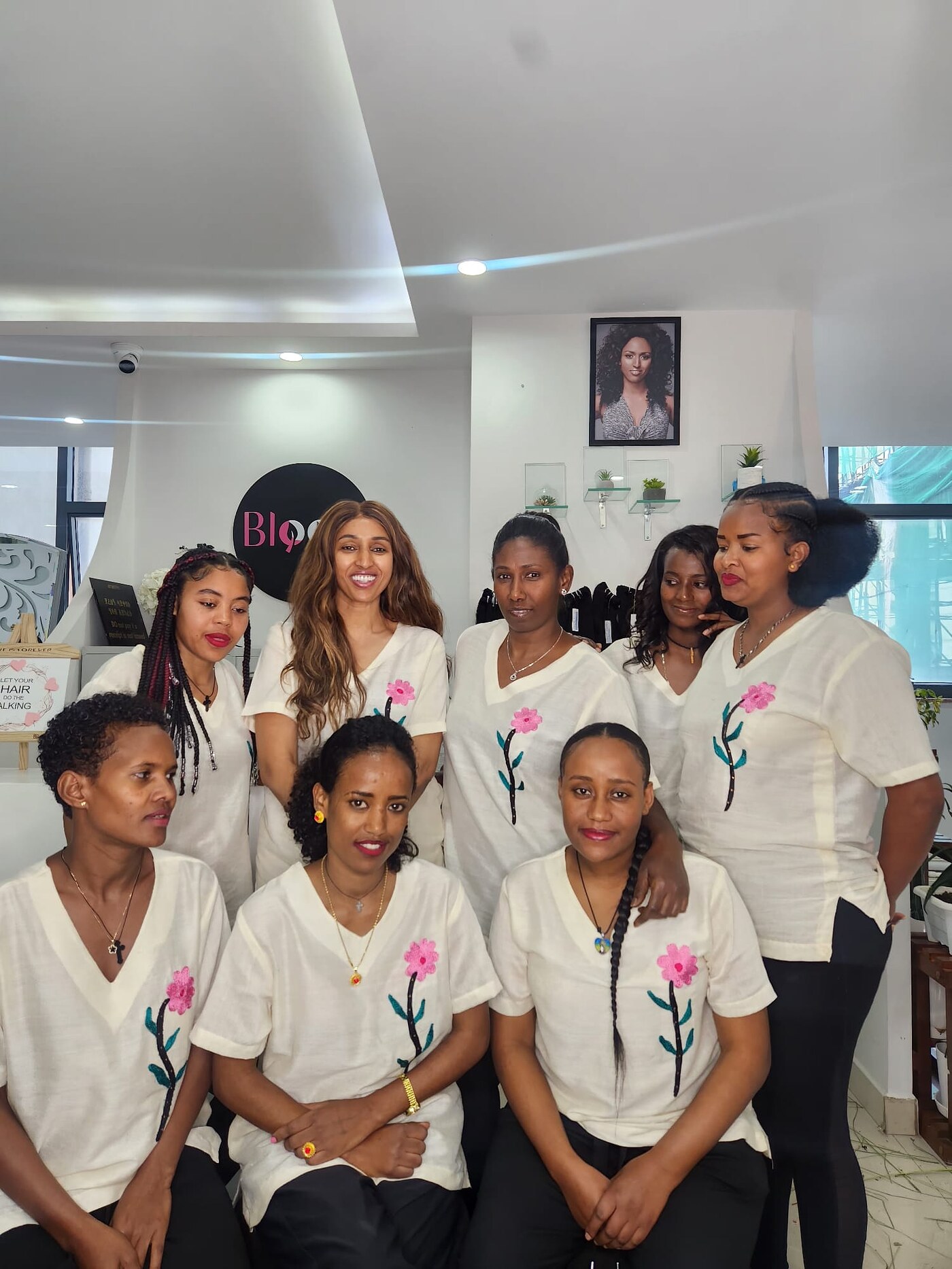 The Bloom Beauty team in matching white shirts with the Bloom flower motif